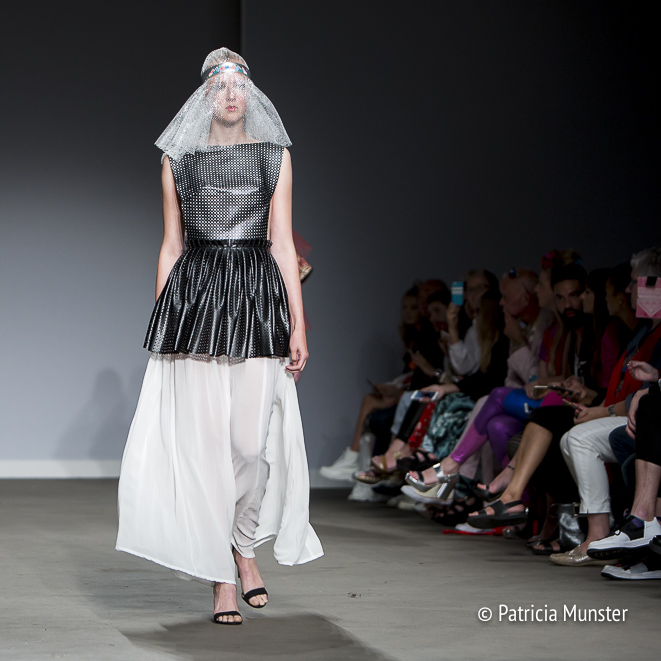 Black 'armour' with white skirt by Maaike van den Abbeele at Fashionweek Amsterdam